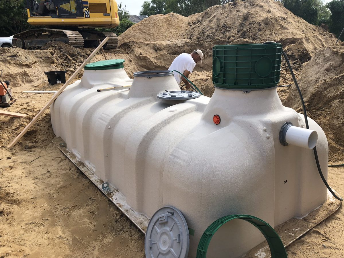 Fuji Clean packaged treatment tank being installed on a commercial job site