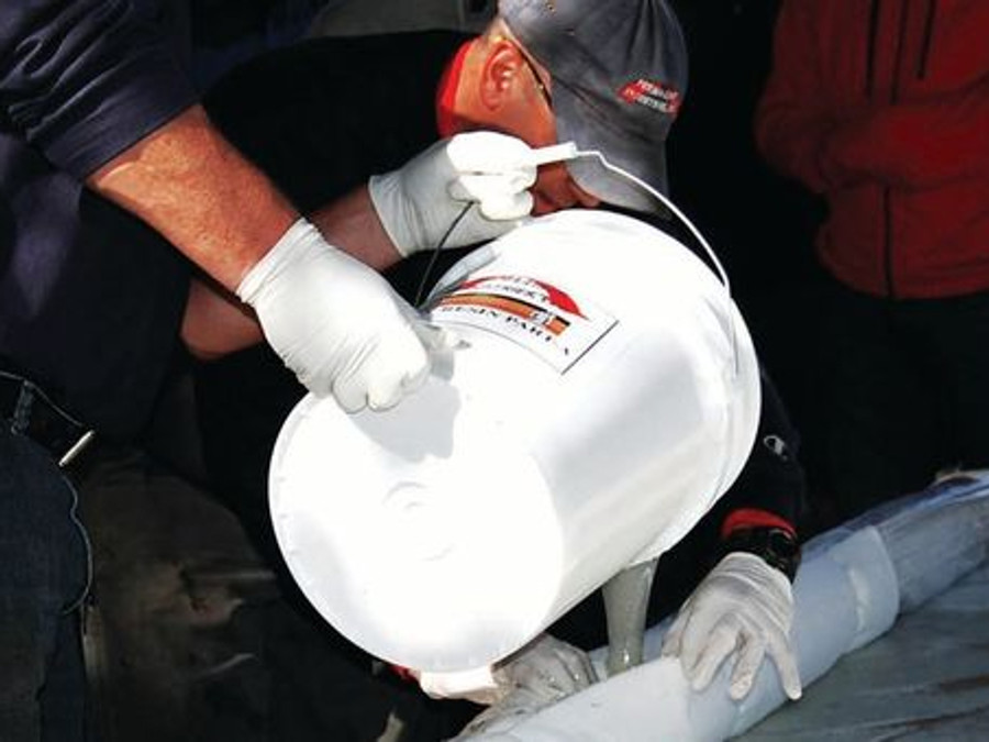 Perma-Liner technician preparing liner material for a trenchless pipe repair installation